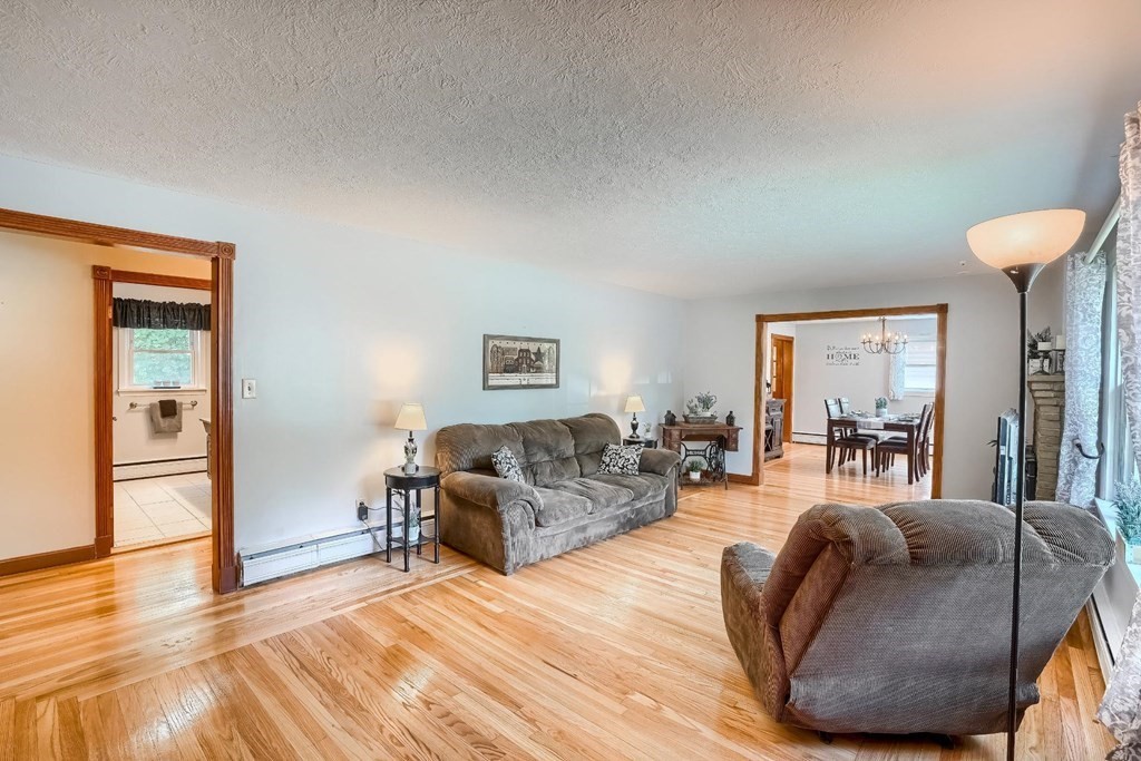361 South Main Street Bellingham, MA 02019 - Photo 16 of 42 a living room with furniture and a wooden floor
