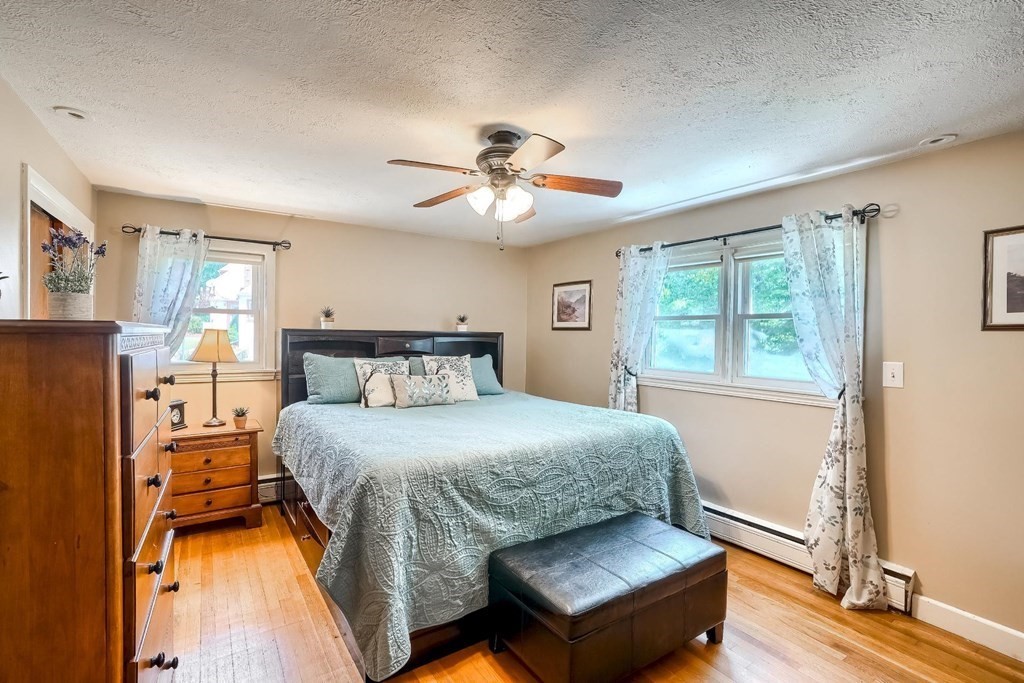 361 South Main Street Bellingham, MA 02019 - Photo 17 of 42 a bedroom with a bed and wooden floor
