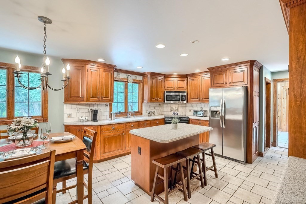 361 South Main Street Bellingham, MA 02019 - Photo 2 of 42 a large kitchen with a table and chairs