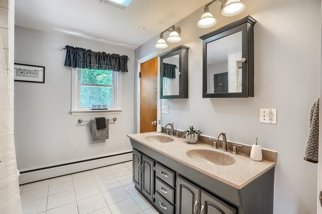 361 South Main Street Bellingham, MA 02019 - Photo 22 of 42 a bathroom with a sink and a mirror