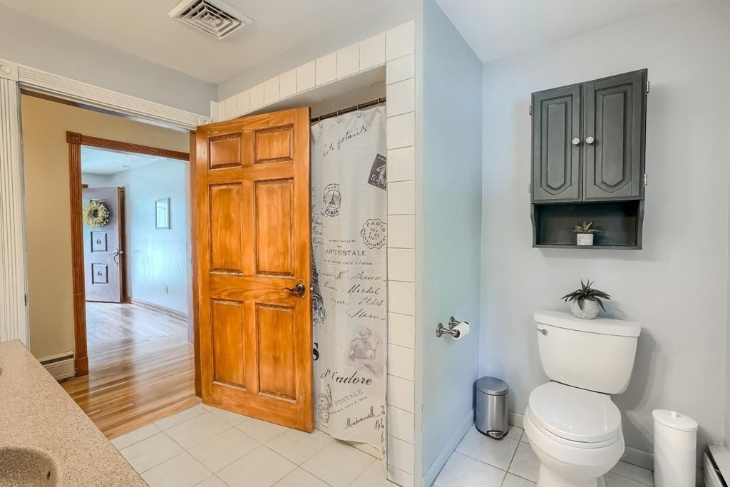 361 South Main Street Bellingham, MA 02019 - Photo 23 of 42 a bathroom with a toilet sink and shower