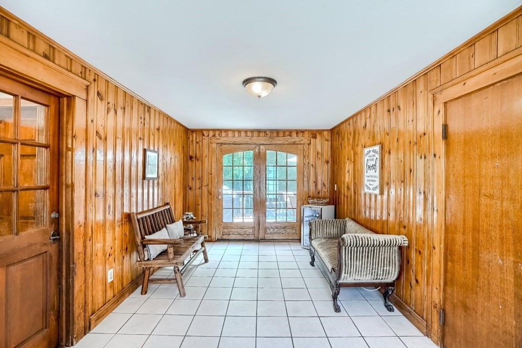 361 South Main Street Bellingham, MA 02019 - Photo 26 of 42 a living room with furniture and a floor to ceiling window