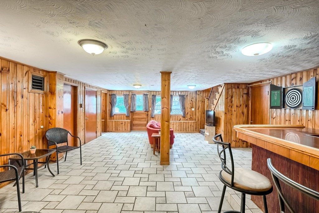 361 South Main Street Bellingham, MA 02019 - Photo 29 of 42 a living room with patio furniture and a large window