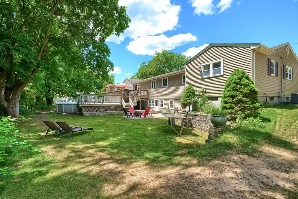 361 South Main Street Bellingham, MA 02019 - Photo 32 of 42 a view of a house with backyard sitting area and garden