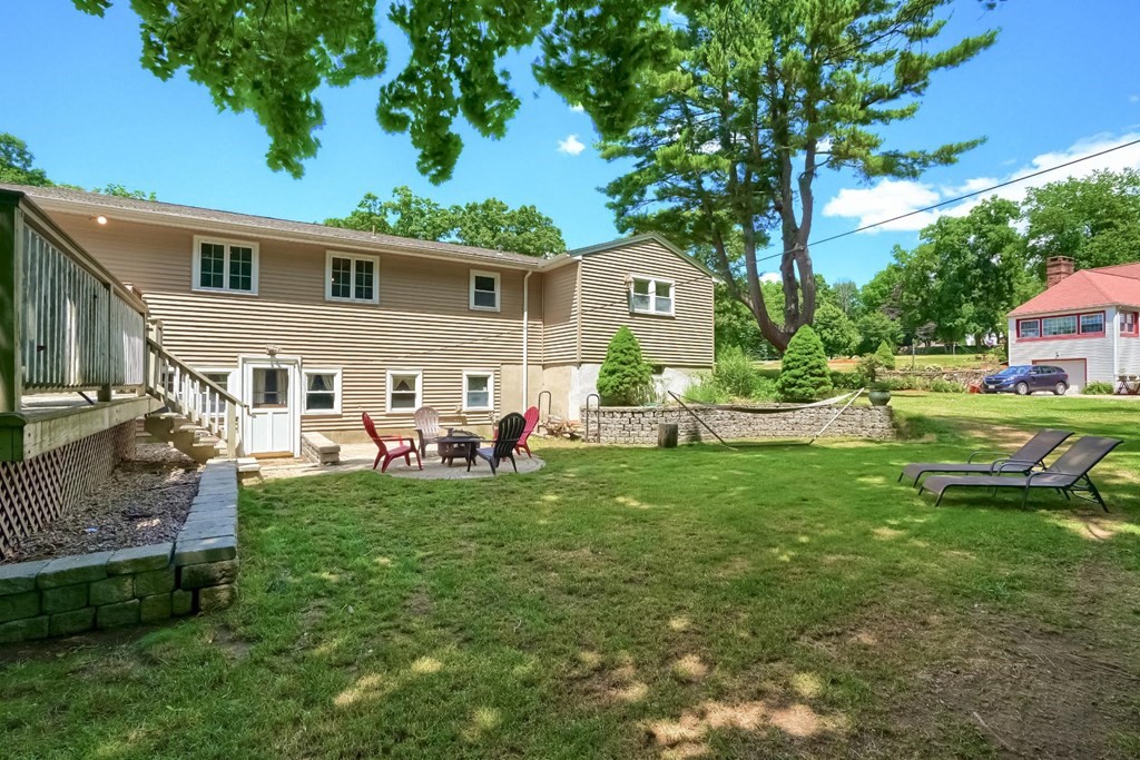 361 South Main Street Bellingham, MA 02019 - Photo 33 of 42 a front view of house with yard and outdoor seating