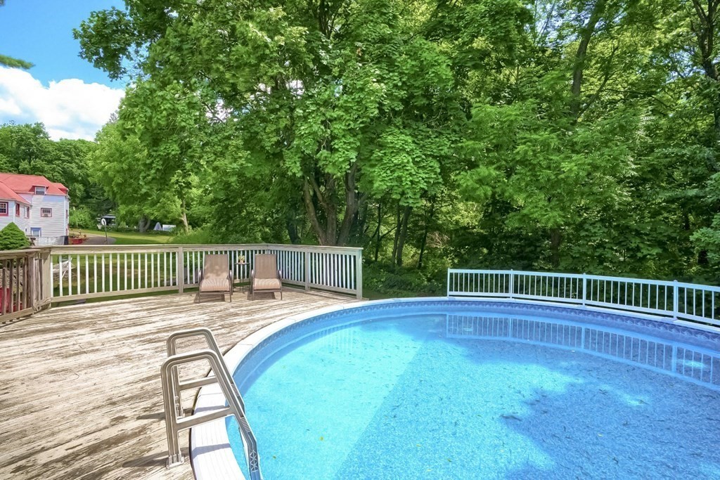 361 South Main Street Bellingham, MA 02019 - Photo 37 of 42 a view of a roof deck with wooden floor and fence