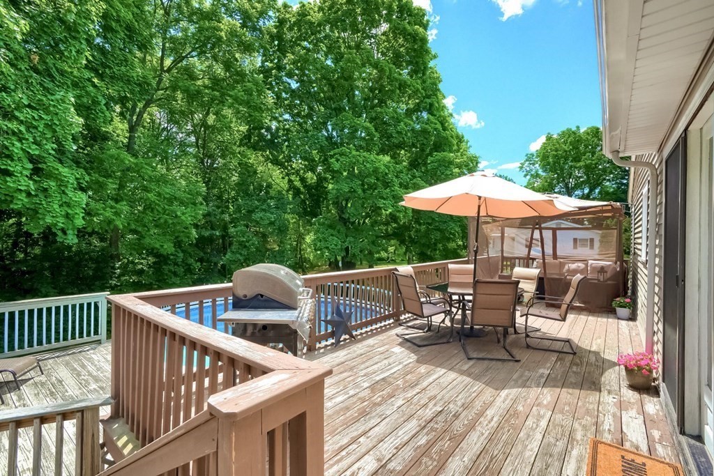 361 South Main Street Bellingham, MA 02019 - Photo 41 of 42 a view of balcony with outdoor seating and wooden floor