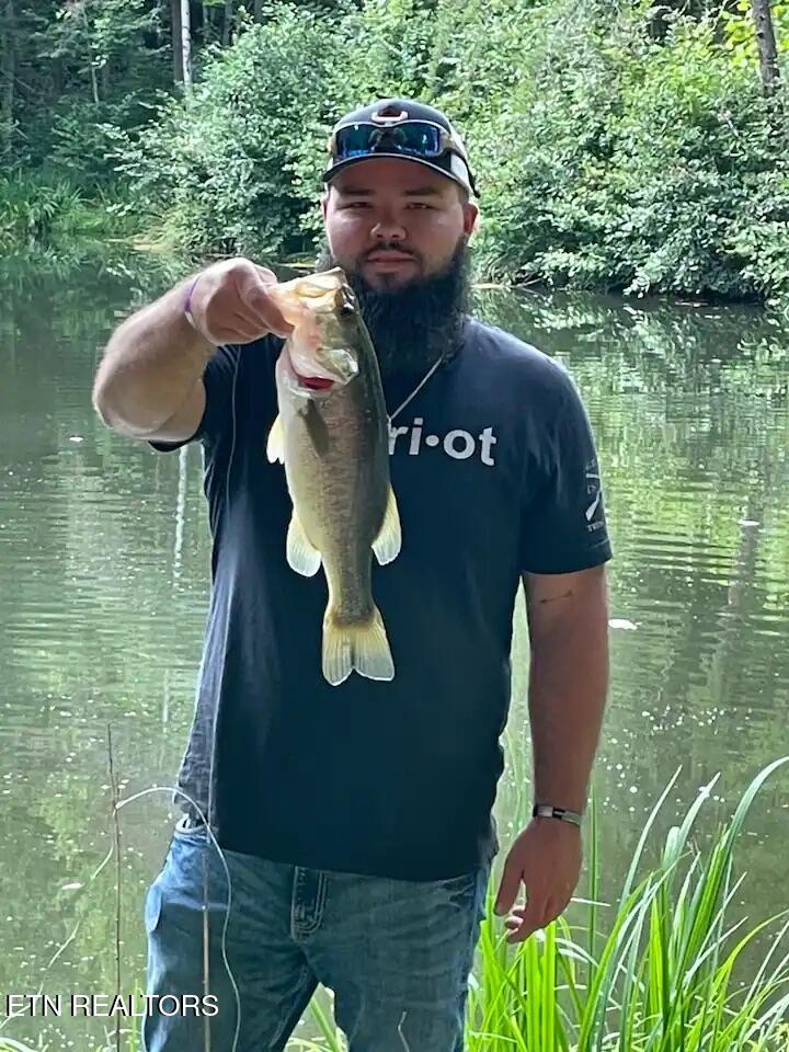 3017 Walters Way Sevierville, TN 37862 - Photo 47 of 52 man with fish