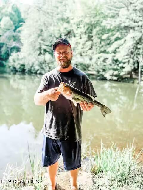 3017 Walters Way Sevierville, TN 37862 - Photo 48 of 52 man with fish