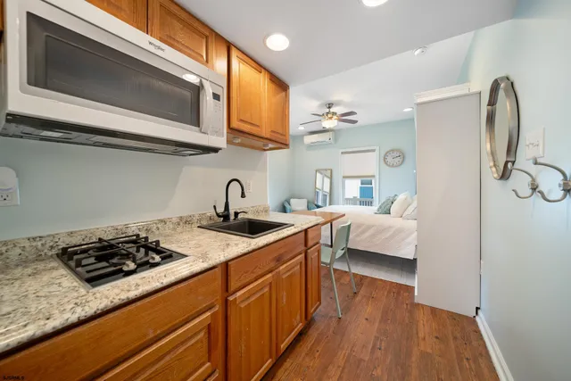 a kitchen with stainless steel appliances granite countertop a stove and a sink