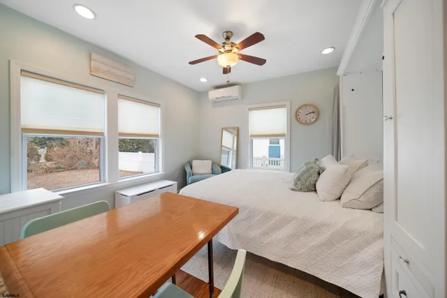 a bedroom with a large bed and a large window