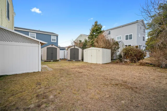 a view of a house with a yard and garage