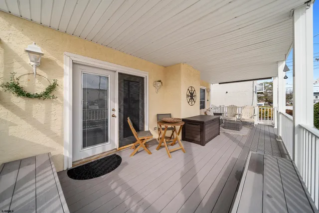 a bedroom with furniture and a wooden floor