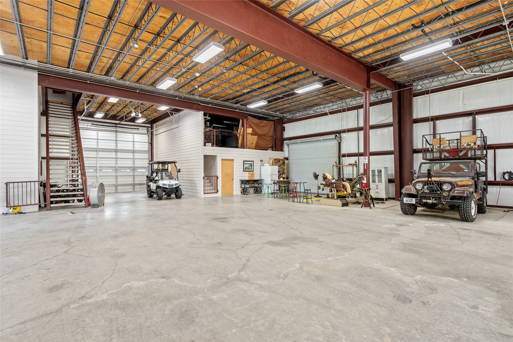 15126 Walden Road Montgomery, TX 77356 - Photo 27 of 50 Purpose built lower level for machinery and tools. Also has a kitchen area, and a dedicated upstairs secure storage
room.