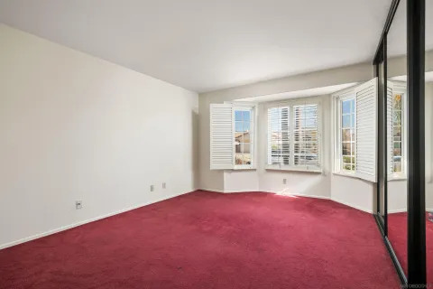 an empty room with sliding glass door