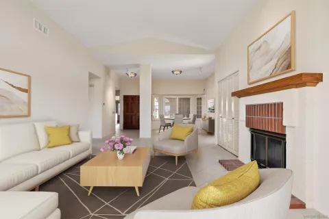 a living room with furniture and a fireplace