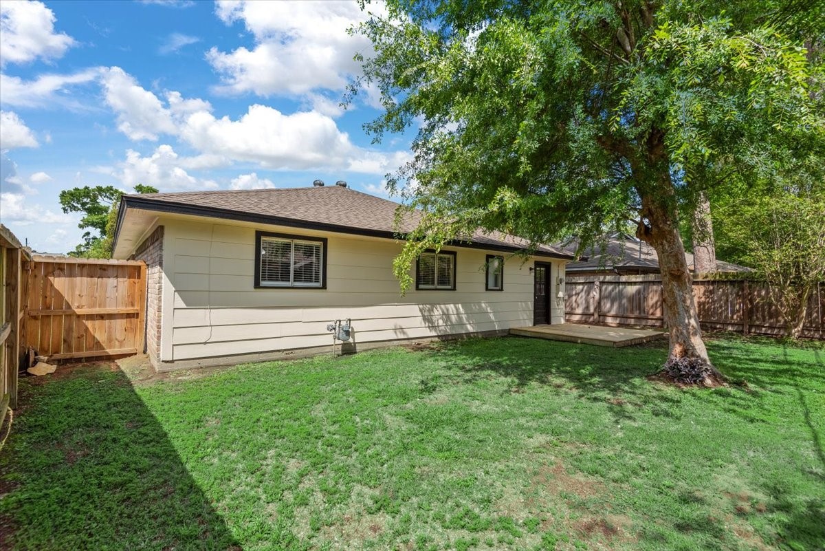 29414 Sedgefield Street Spring, TX 77386 - Photo 24 of 25 Mature tree provides great shade for sitting on the deck and relaxing!