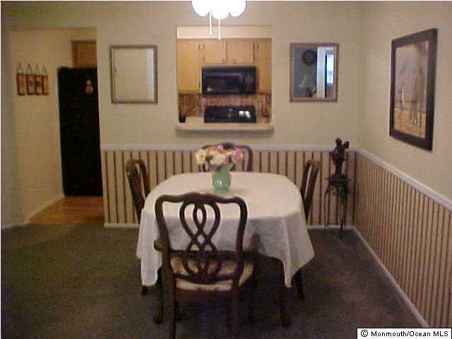 25 Racquet Road Wall, NJ 07719 - Photo 3 of 3 a view of a dining room with furniture and wooden floor