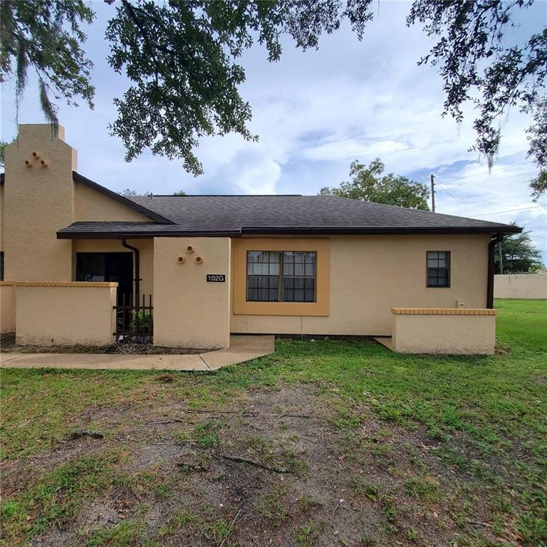 603 Water Road, Unit 102G Ocala, FL 34472 - Photo 3 of 10 a front view of a house with garden