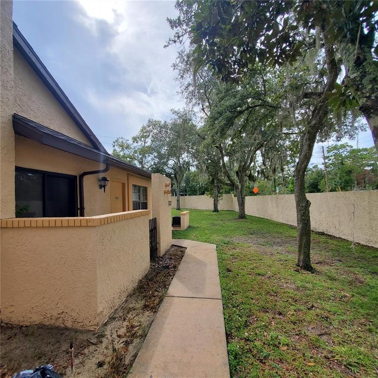 603 Water Road, Unit 102G Ocala, FL 34472 - Photo 5 of 10 a view of a back yard of the house