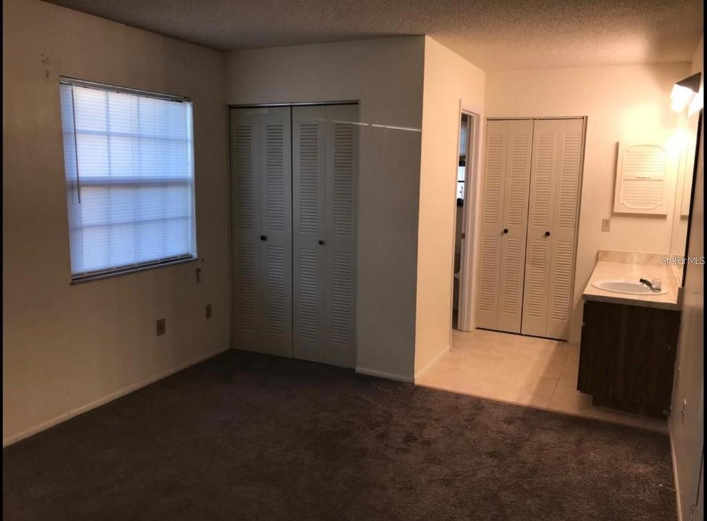 603 Water Road, Unit 102G Ocala, FL 34472 - Photo 6 of 10 a view of an empty room with a window