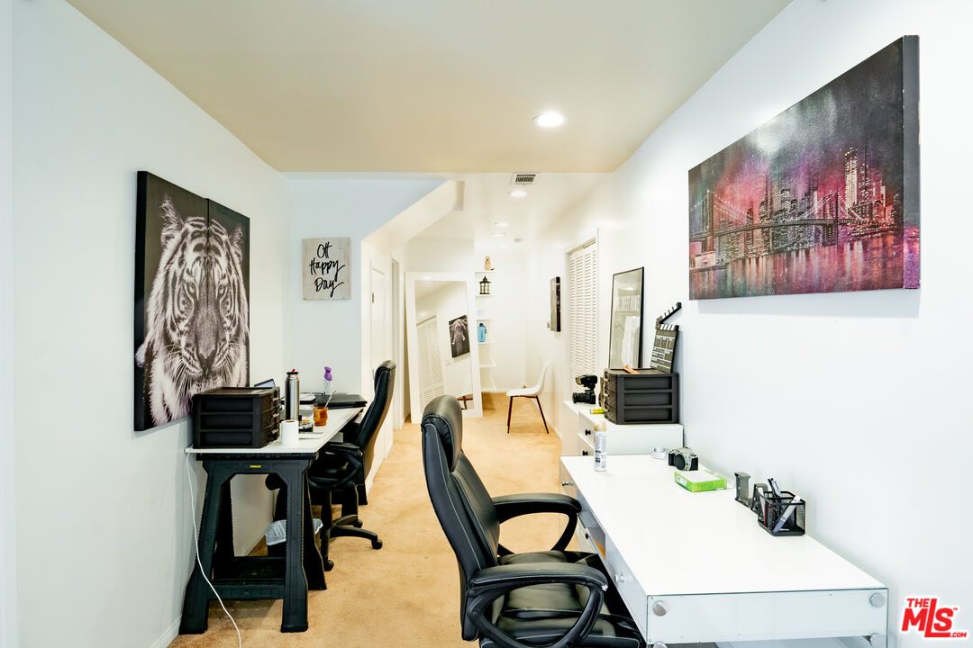 10090 Cielo Drive Beverly Hills, CA 90210 - Photo 11 of 19 a view of a dining room with furniture