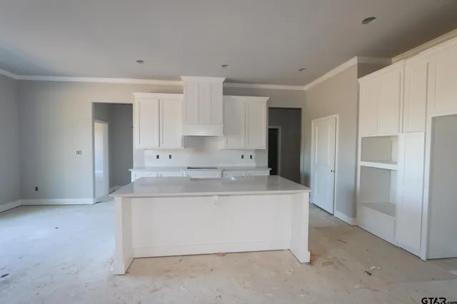 a view of kitchen with white cabinets