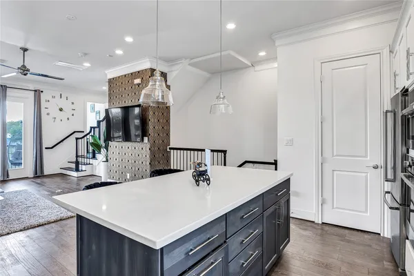 a bathroom with a sink a vanity and a large mirror