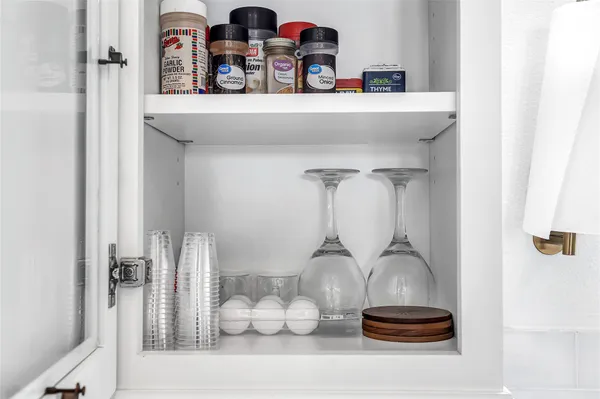a kitchen with a refrigerator and a sink