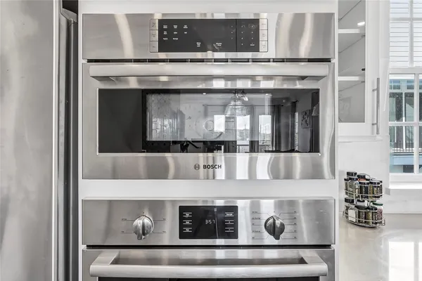 a stove top oven sitting inside of a kitchen