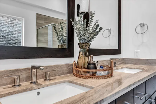 a bathroom with sink and mirror