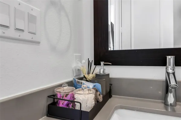 a bathroom with a sink toilet and tub