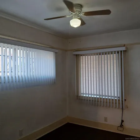 a bathroom with a shower and a toilet