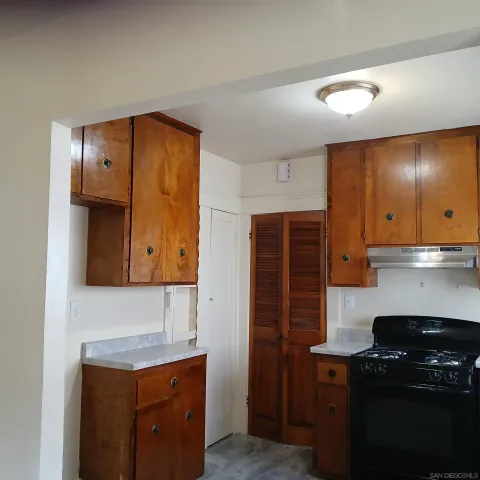 a kitchen with stainless steel appliances granite countertop a stove and a refrigerator