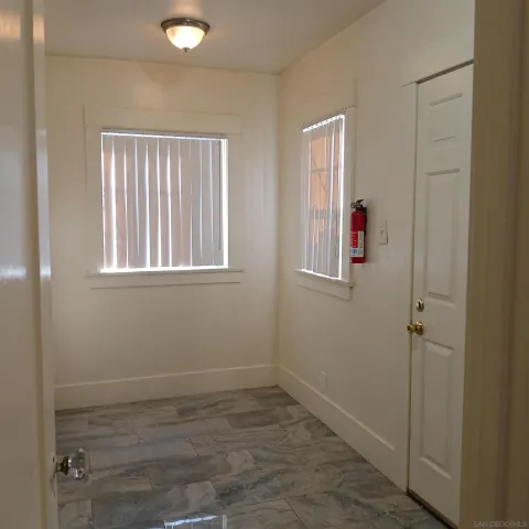 wooden floor and window in an empty room