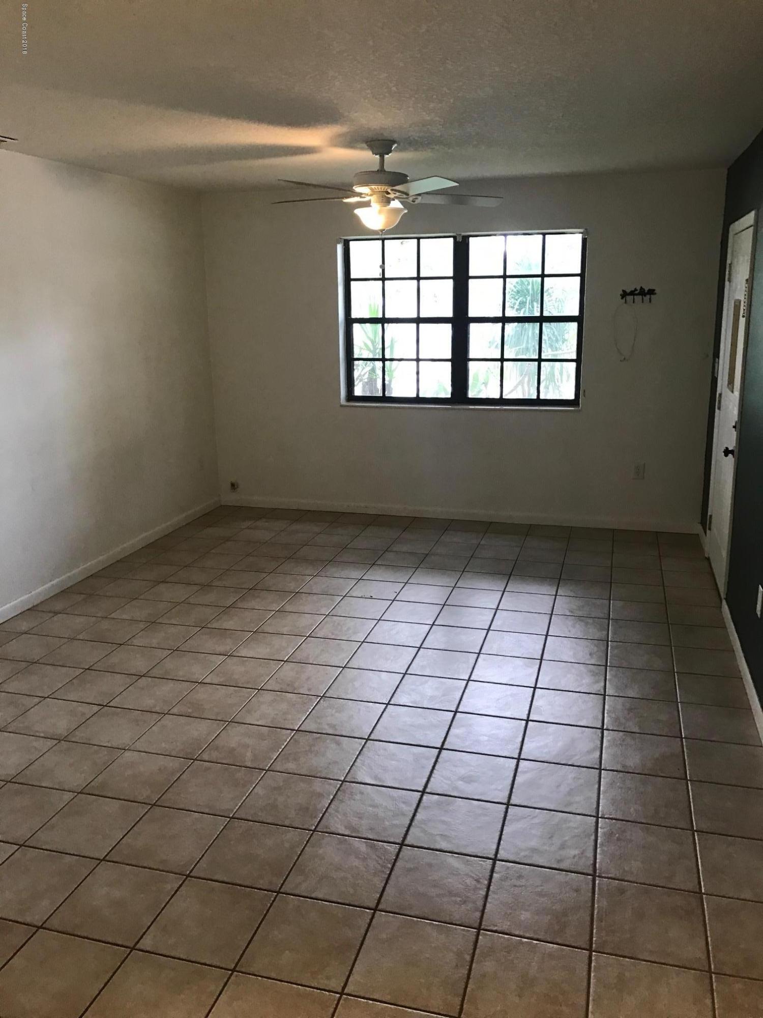 504 Cornell Avenue Melbourne, FL 32901 - Photo 3 of 10 a view of an empty room and window
