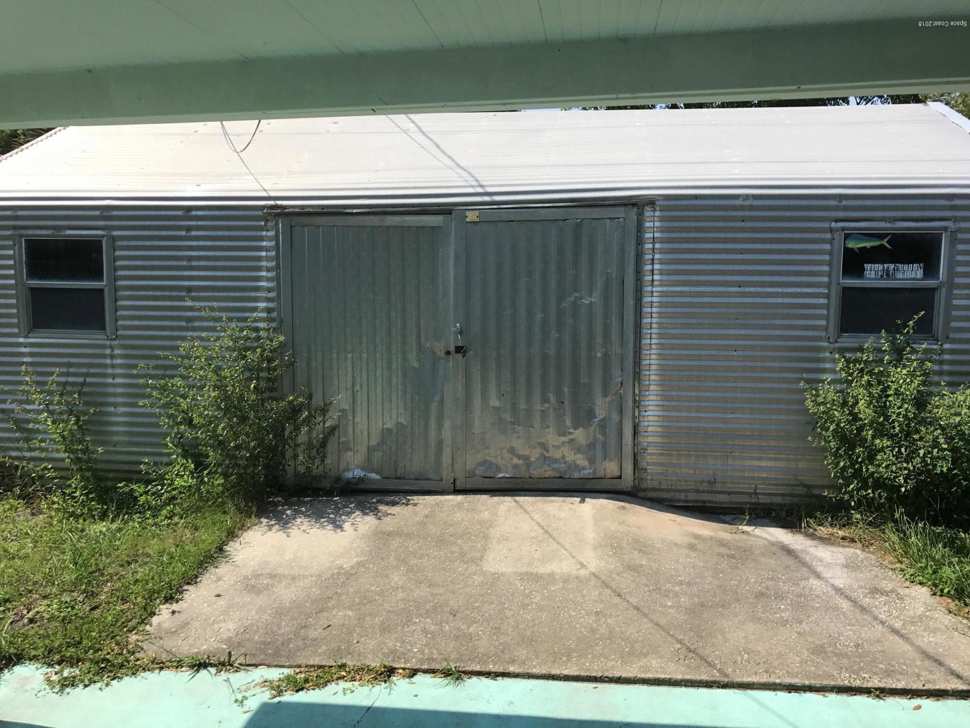 504 Cornell Avenue Melbourne, FL 32901 - Photo 10 of 10 a view of backyard with potted plants