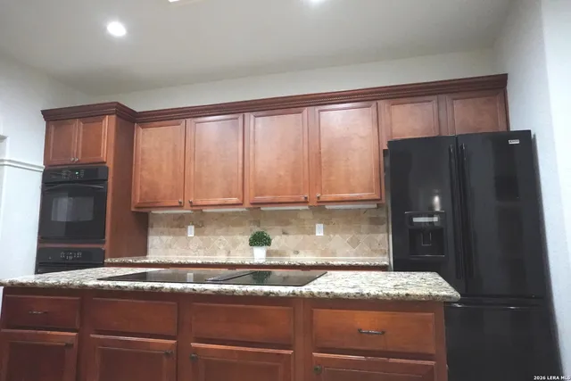 a bedroom with a bed and a television