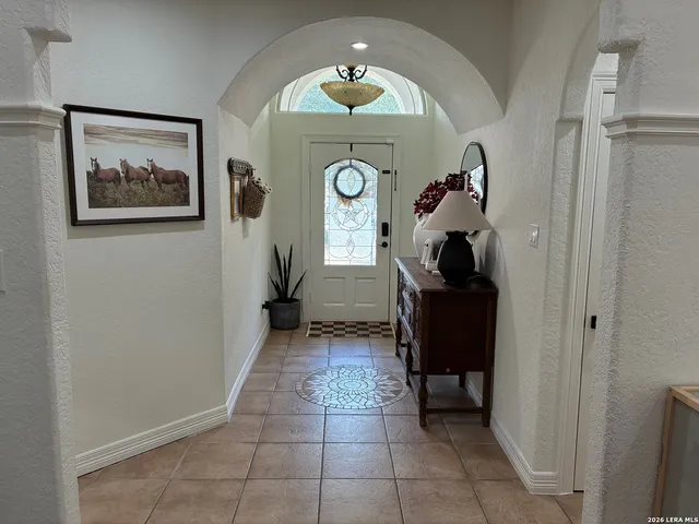 a bedroom with two beds and a window