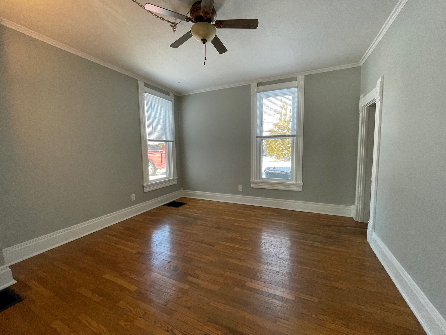 202 Witt Park Road Sidney, IL 61877 - Photo 14 of 49 a view of empty room with wooden floor and fan
