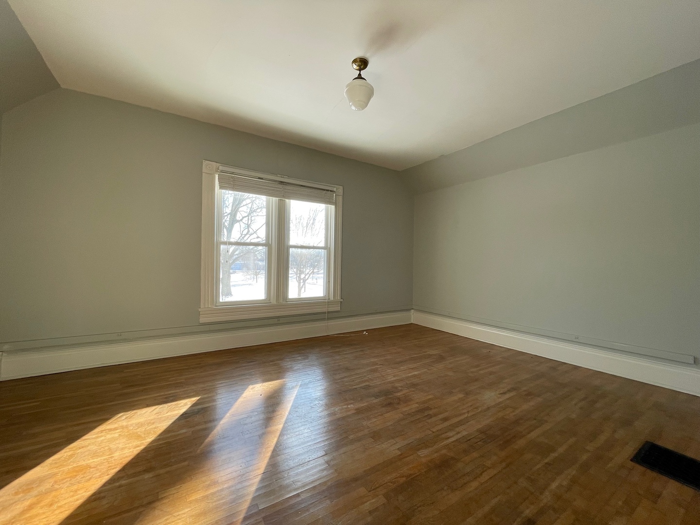 202 Witt Park Road Sidney, IL 61877 - Photo 15 of 49 an empty room with wooden floor and windows