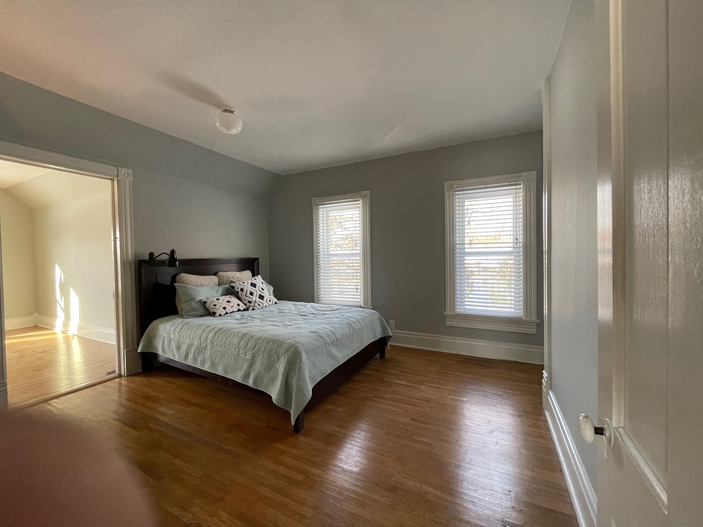 202 Witt Park Road Sidney, IL 61877 - Photo 16 of 49 a bedroom with a bed and wooden floor