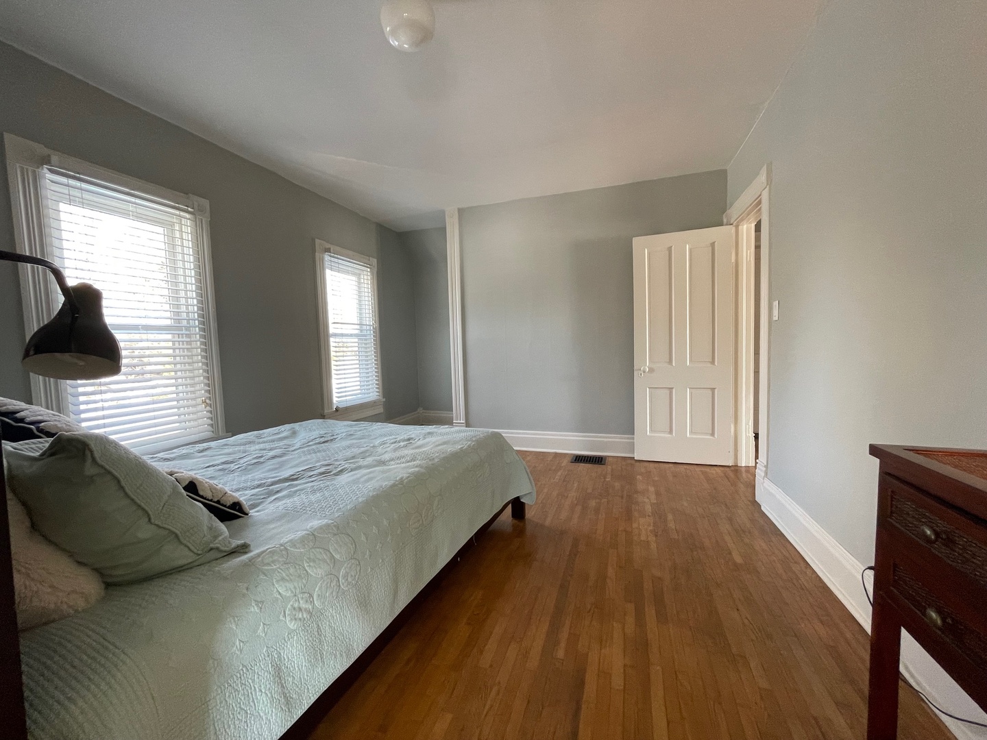 202 Witt Park Road Sidney, IL 61877 - Photo 18 of 49 a bedroom with a bed and wooden floor