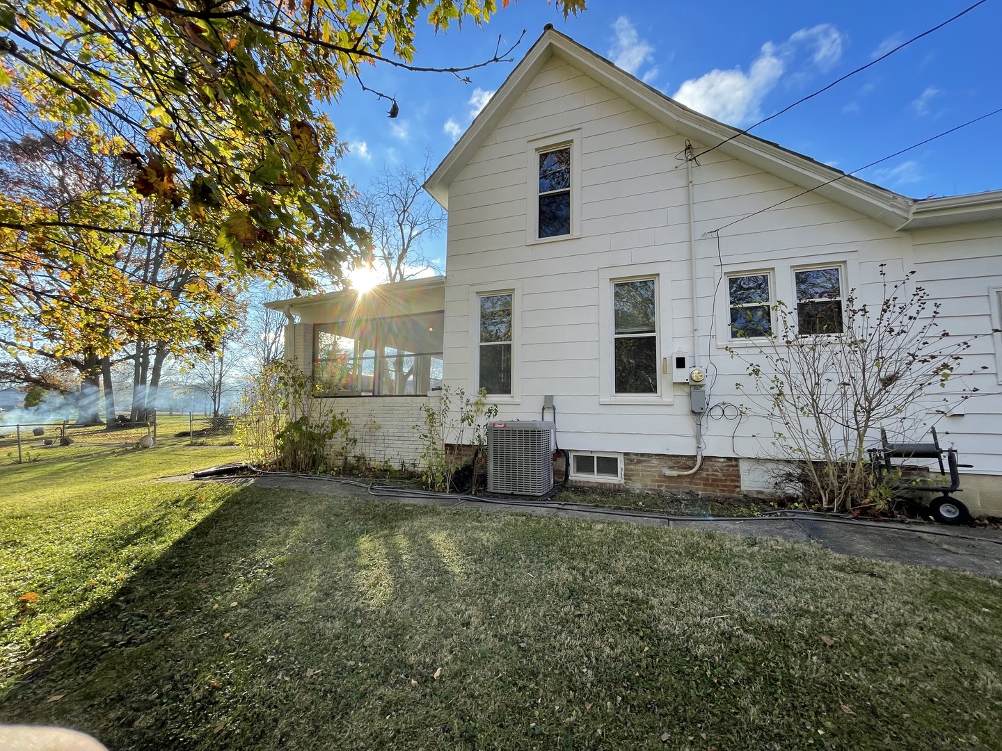 202 Witt Park Road Sidney, IL 61877 - Photo 45 of 49 a view of a house with a yard