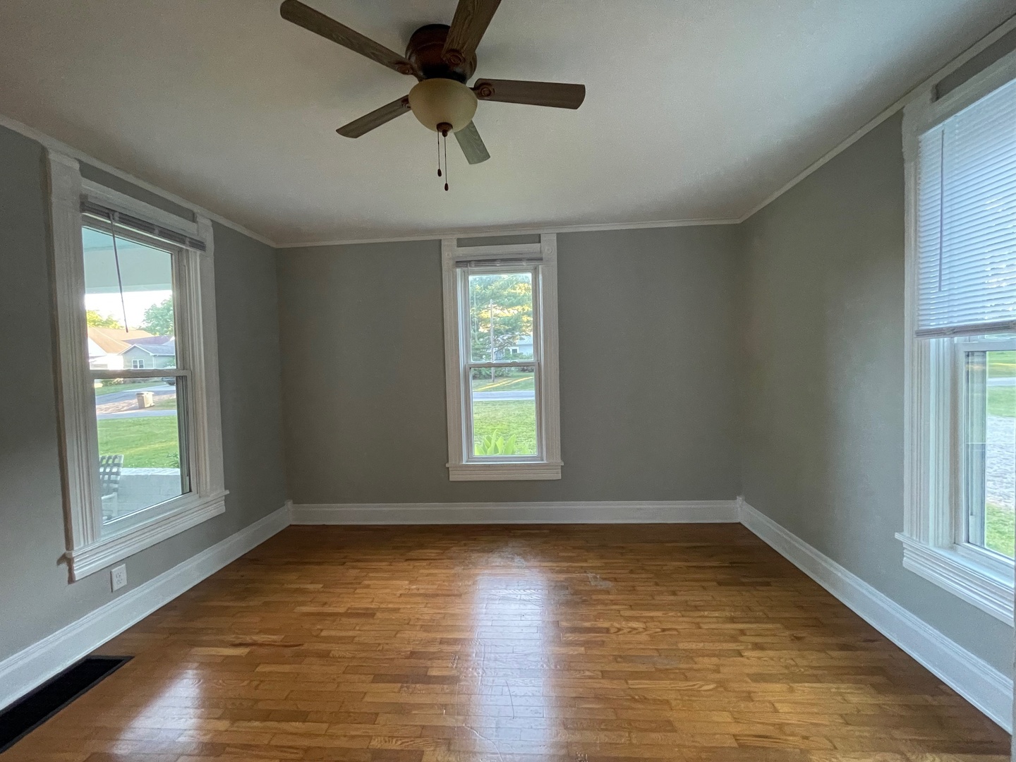 202 Witt Park Road Sidney, IL 61877 - Photo 7 of 49 wooden floor in an empty room with a window