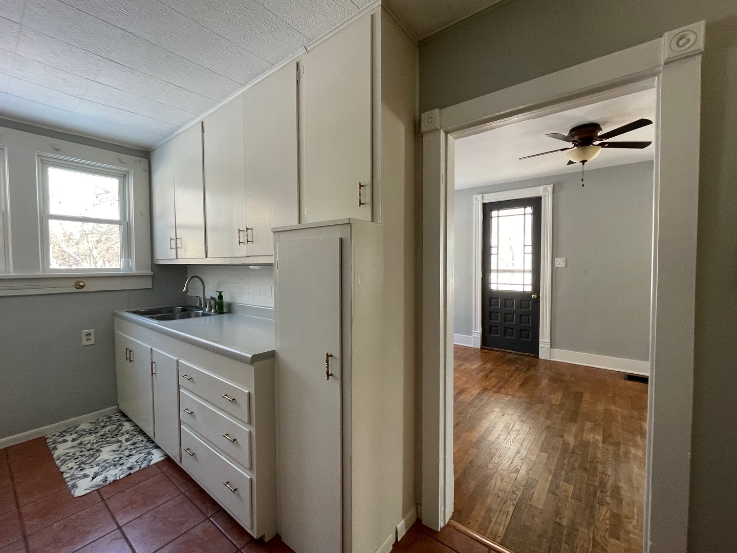 202 Witt Park Road Sidney, IL 61877 - Photo 8 of 49 a kitchen with a sink stove and cabinets
