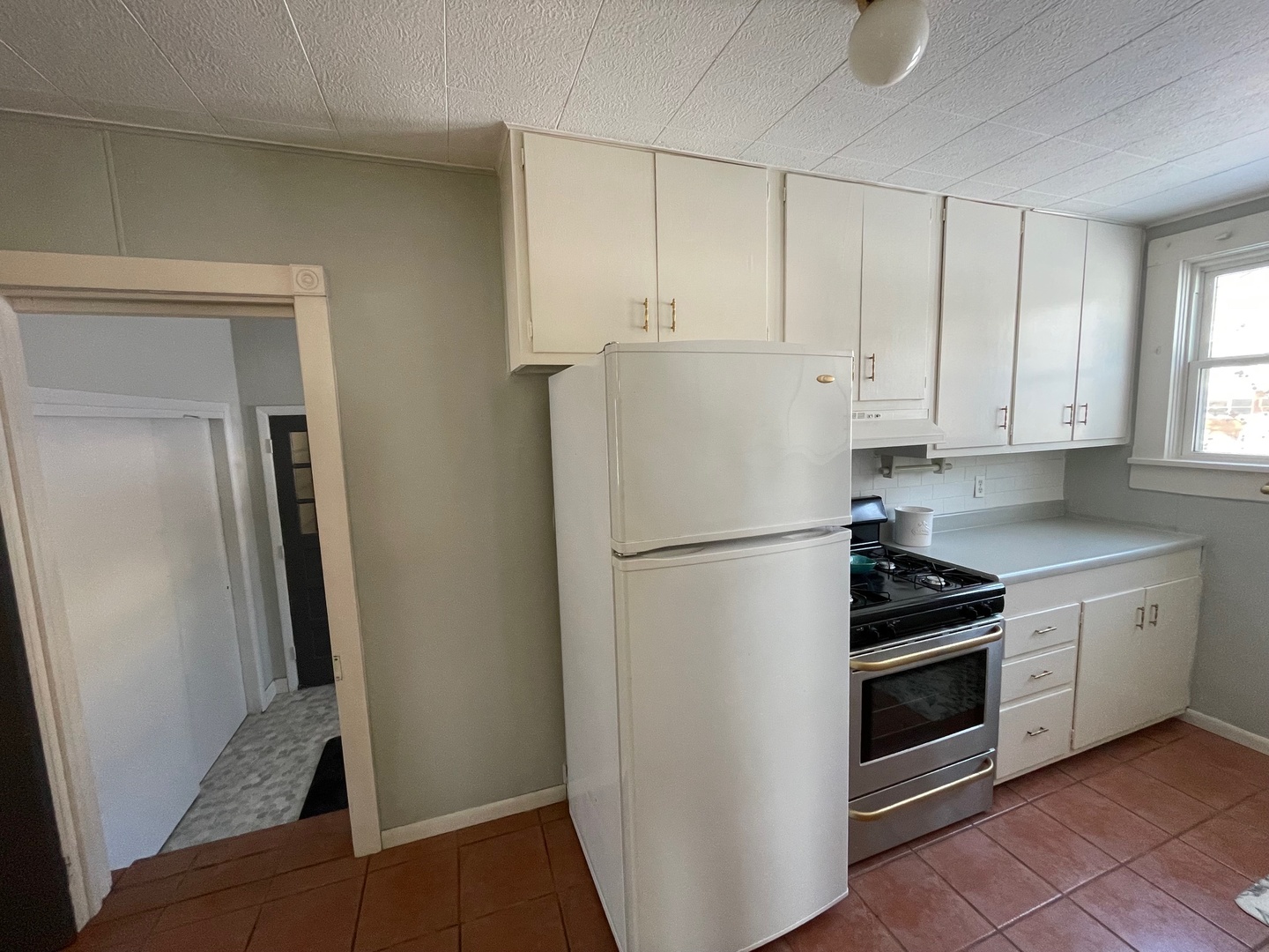 202 Witt Park Road Sidney, IL 61877 - Photo 9 of 49 a white refrigerator freezer and a stove sitting inside of a kitchen