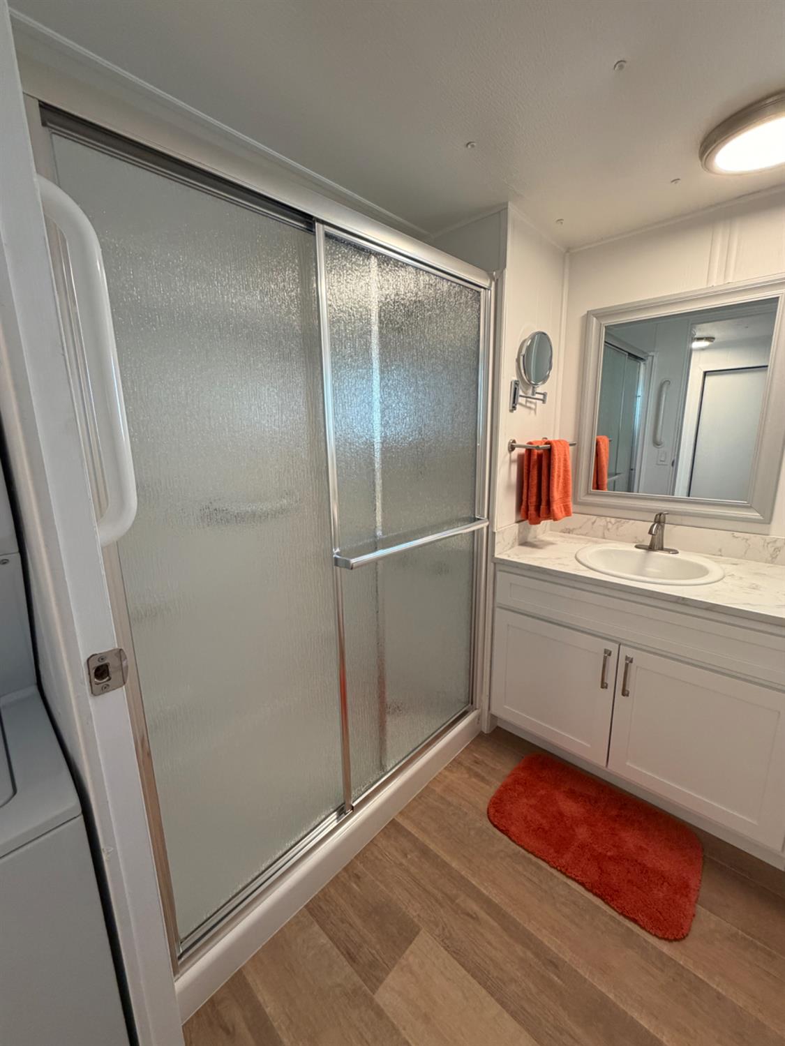 9060 Auburn Folsom Road, Unit 19 Granite Bay, CA 95746 - Photo 12 of 30 a bathroom with a sink mirror and vanity