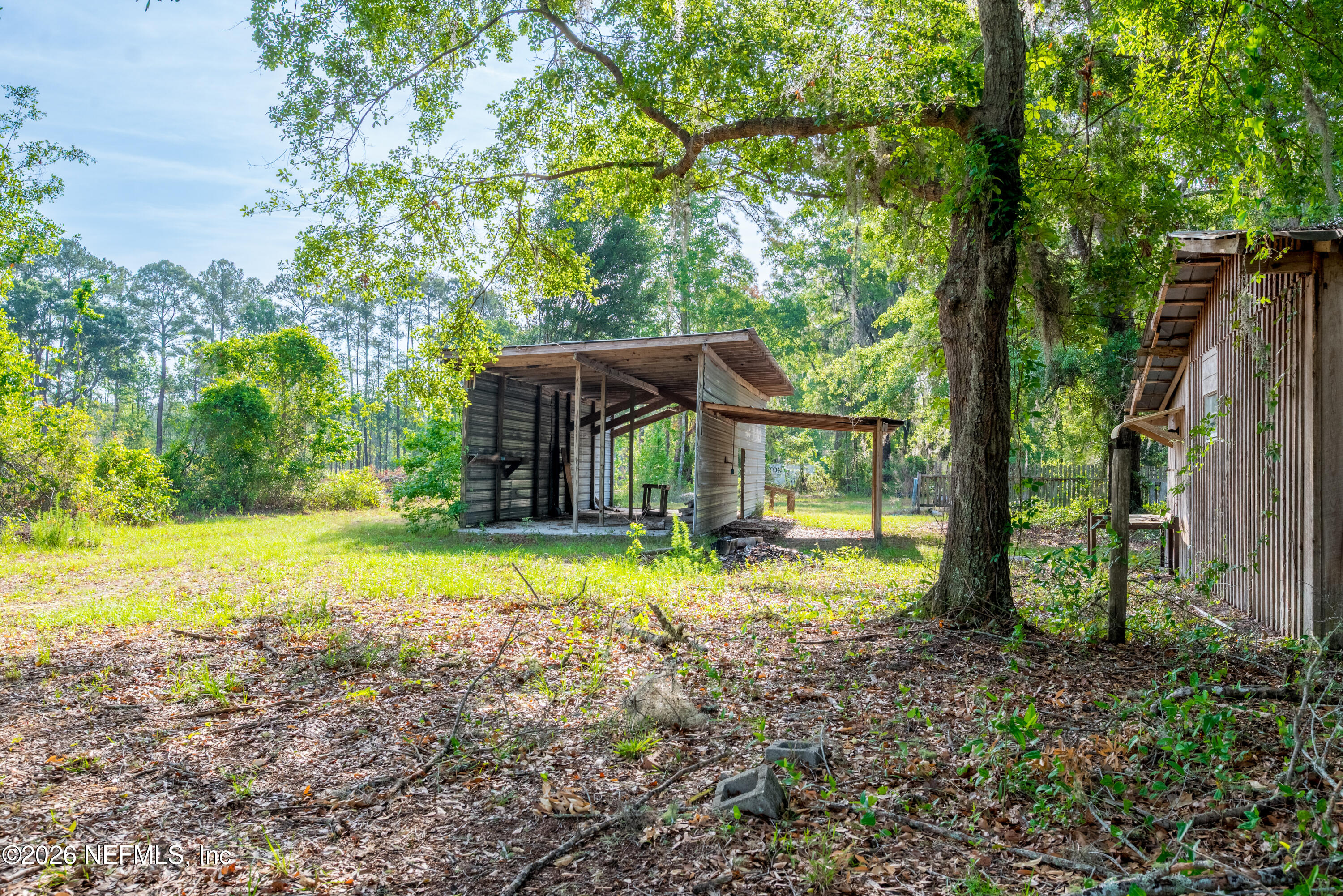 12781 Highway 100 Lake Butler, FL 32054 - Photo 14 of 100 a view of a house with backyard and sitting area