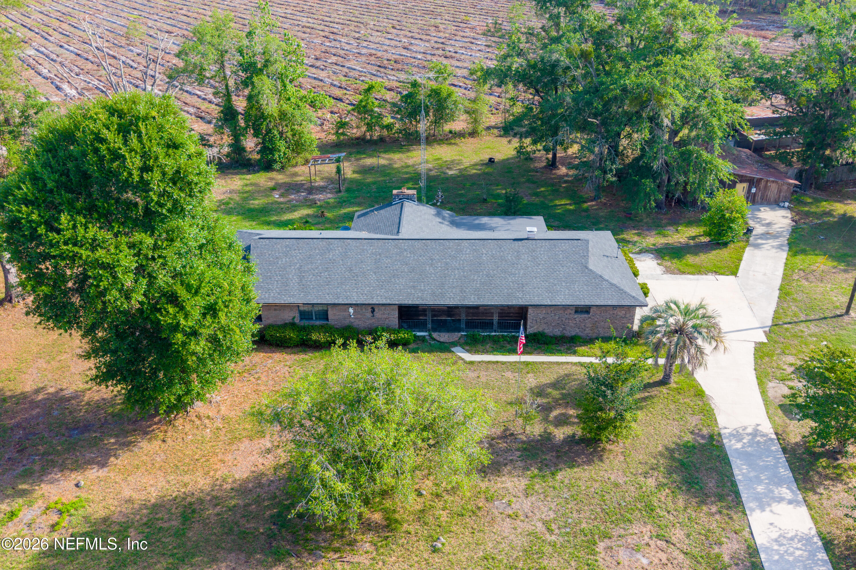 12781 Highway 100 Lake Butler, FL 32054 - Photo 20 of 100 a view of a house with a yard plants and large tree